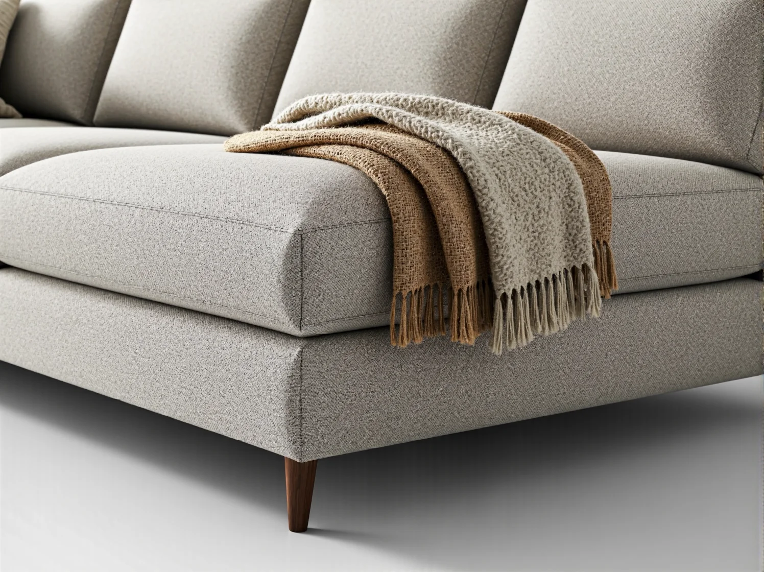 Elegancki narożnik w minimalistycznym salonie, połączenie funkcjonalności z prostym designem.